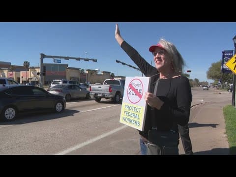 Federal workers in Houston rally against job cuts at USPS, NASA, NOAA
