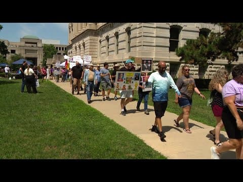 Protesters march outside Indiana Statehouse against President Trump, hope Gen Con visitors join