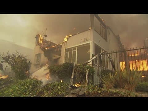 Strong winds move fire in Pacific Palisades destroying homes, bank