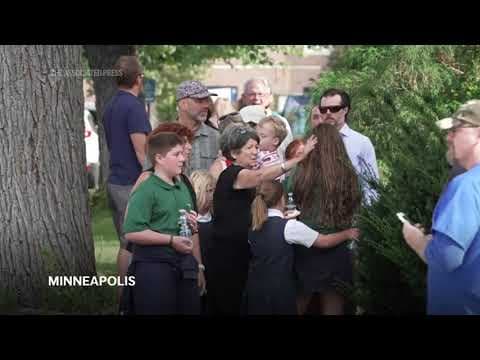 Hugs, kids checking on each other outside shooting at Minneapolis Catholic school