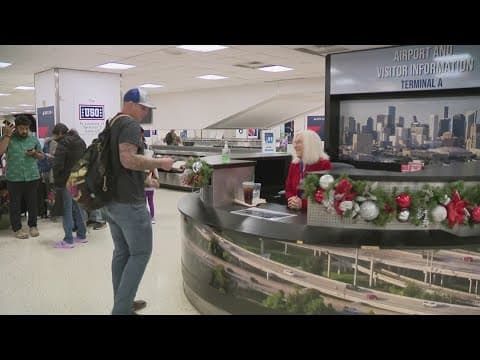 Houston airport volunteers help travelers get around
