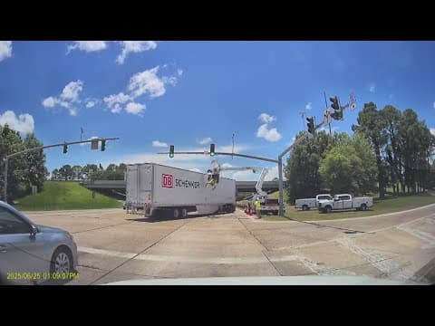Electrical worker dangles mid-air after 18-wheeler collision