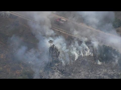 Firefighters stop spread of brush fire in San Carlos