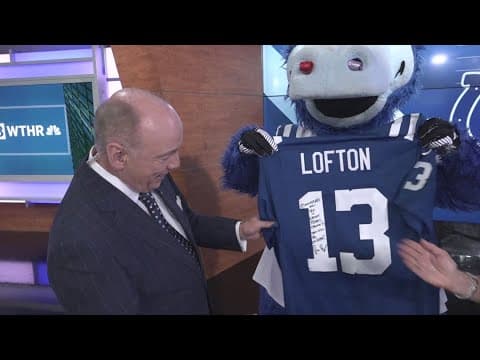 Chuck Lofton receives Colts jersey signed by the late Jim Irsay
