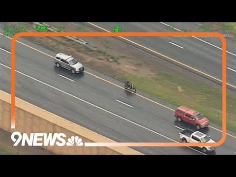 Aerial video shows motorcycle driver speeding, weaving through traffic