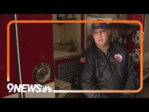 Firefighter rescues person stuck inside trash truck