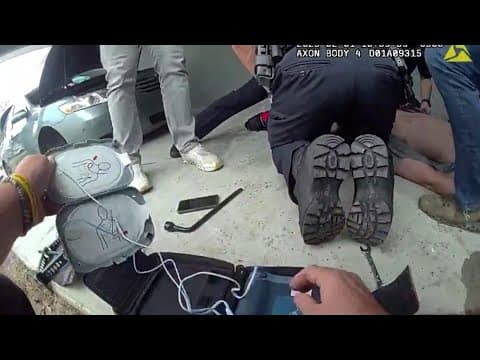 Police body camera shows rescue of man pinned under car in Tampa