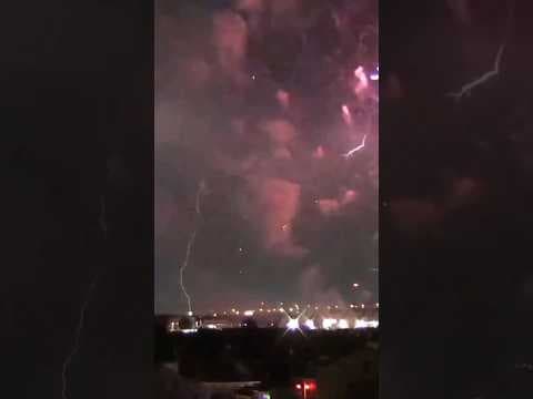 Fireworks and lightning strike in unison on 4th of July in New Orleans.