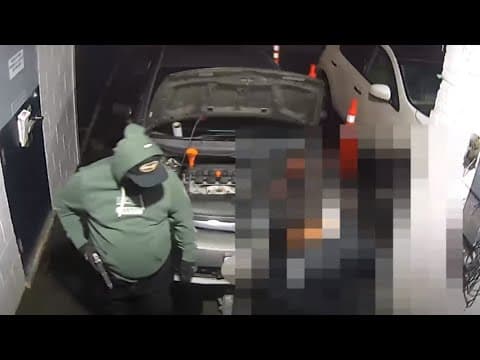 Armed robbery at auto body shop caught on camera, police search for suspect