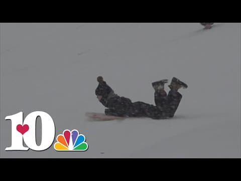 People enjoying the snow as many businesses are closed