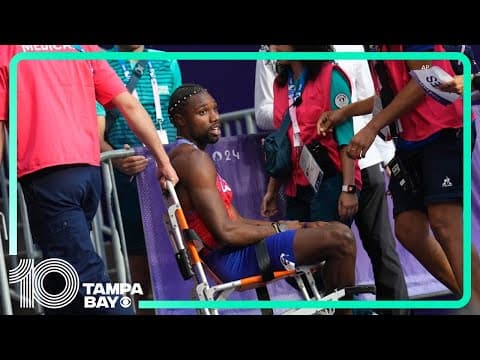 Noah Lyles carted off track after men's 200 final