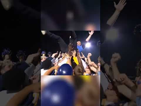 Crowd-surfing at Mooresville High School during Operation Football's Sunrise Kickoff