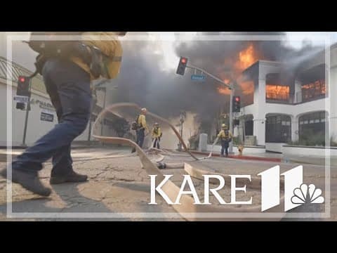 Winds die down as fires rage across Los Angeles area