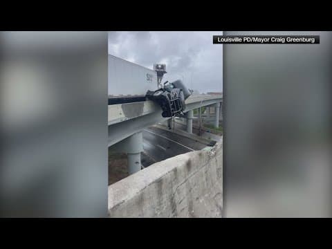 Semi driver rescued after crash causes truck to dangle off Kennedy Bridge