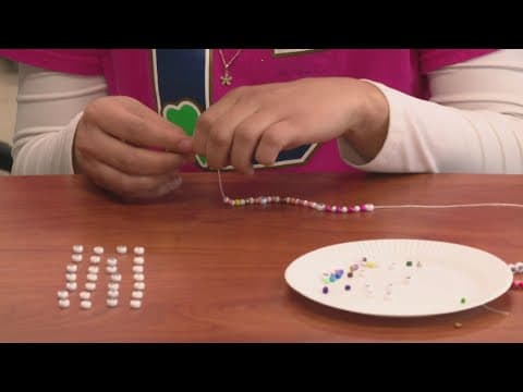Making friendship bracelets for IMPD officers