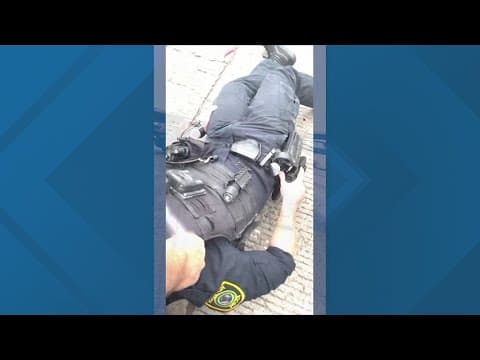 Video: Man pulls wounded HPD officer to safety during shootout on Southwest Freeway