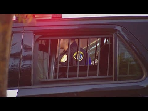 Man arrested after shootout with guard at grocery store