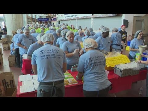 Hundreds of volunteers pack meals at Houston Food Bank in honor of 9/11