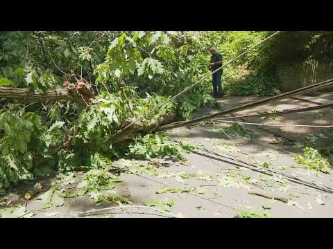 A massive tree, downed power line is blocking his driveway after severe weather