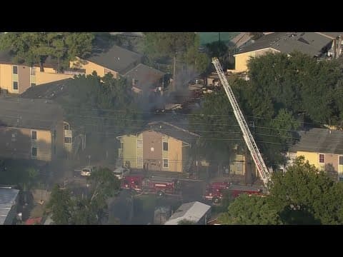 Crews battling large apartment fire near the North Freeway