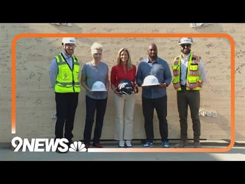 Broncos celebrate topping out at new training facility