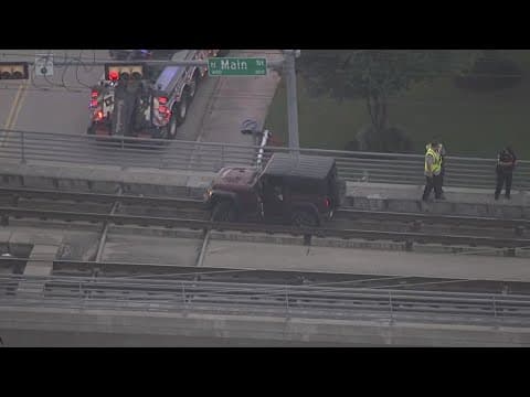 Jeep stuck on the METRO rail line tracks in downtown Houston
