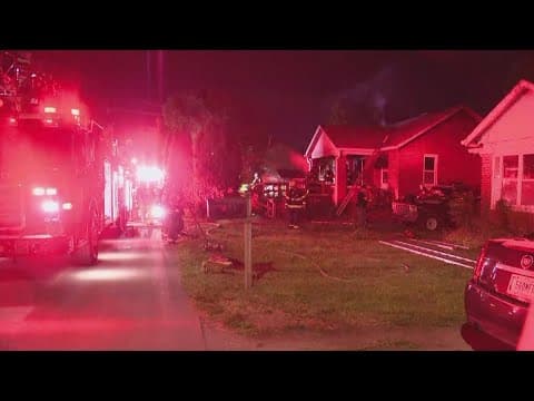 Lawrence police officer notices a house on fire while driving by