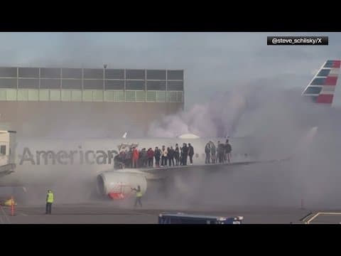 American Airlines plane catches fire at Denver airport