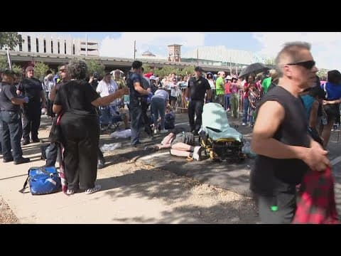 Heat takes toll on people in line waiting to get into Shell Energy Stadium to see VP Kamala Harris