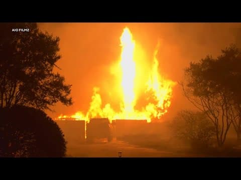 Wildfire sparked by a burning car triples in size in a day. A 42-year-old man is arrested