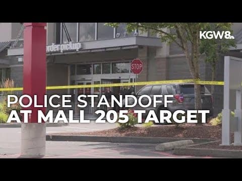 Police officers block entrance to Target store at Mall 205