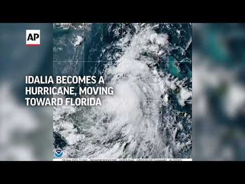 Idalia strengthens to a hurricane, pushing a surge of ocean water toward Florida