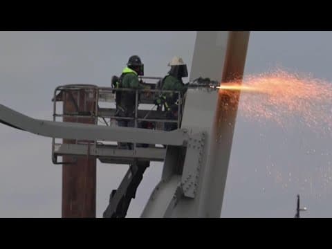 Crews begin cutting down debris from Key Bridge collapse