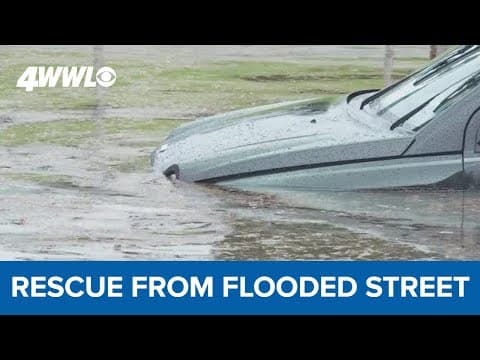High water on New Orleans street strands cars; man rescued from water