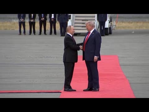 Trump arrives at Alaska military base, greets Putin on tarmac before summit on Russia-Ukraine war