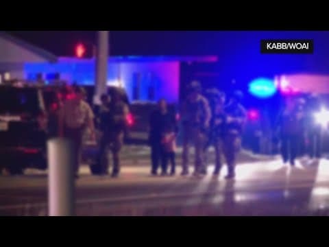 Children leave hotel after their parents are arrested after a standoff in a Texas hotel