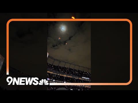 Skydivers land in Denver Broncos’ stadium during Christmas light halftime show