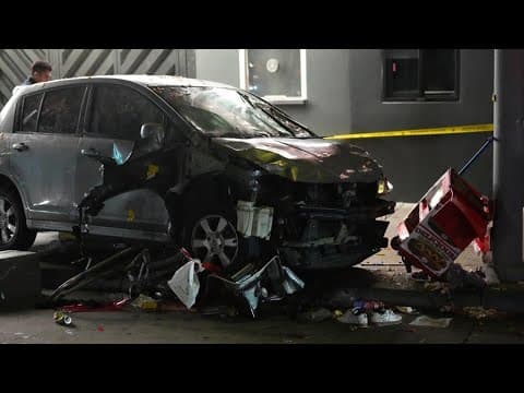 Man whose car struck crowd outside Los Angeles club, injuring 30, was shot, attacked by crowd