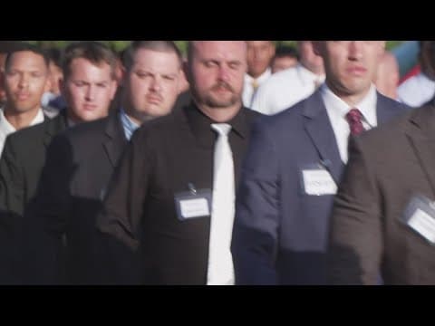 Dallas police swear in new class of officers as hiring requirement looms