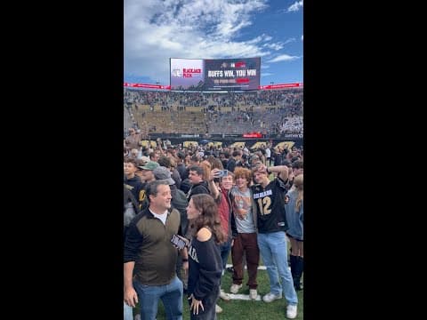 CU fans rush the field after defeating No. 22 Iowa State