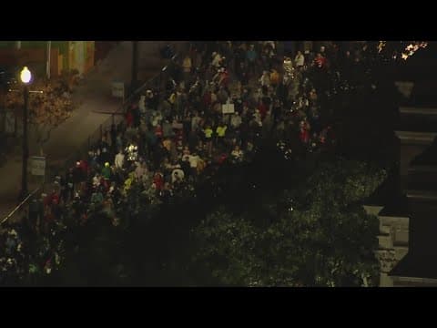 Runners try to stay warm during Chevron Houston Marathon