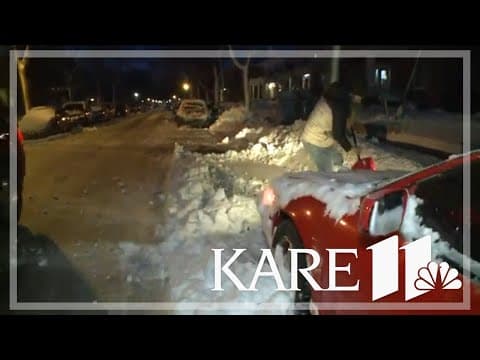 Minneapolis drivers dig out cars in snow emergency