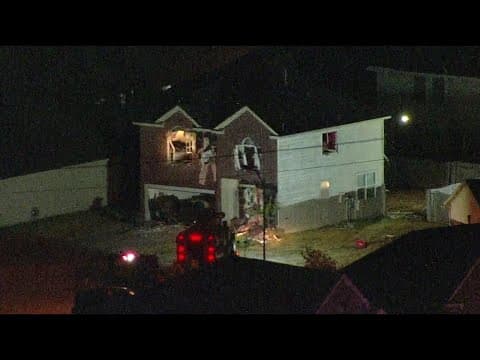 Law enforcement uses equipment to tear down home with barricaded suspect