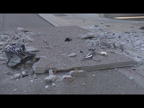 Vehicle crashes into building at Poydras and Camp Streets, debris closes lane