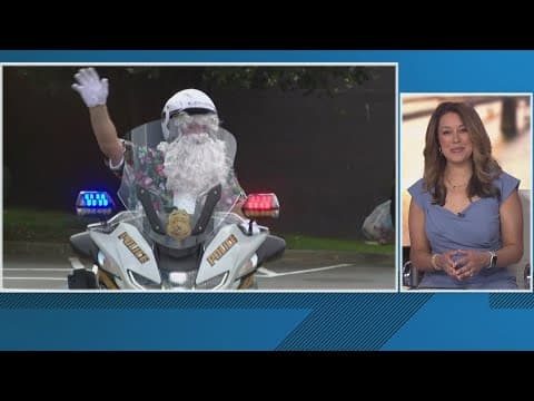 Summer Santa rolls up on police motorcycle in Montgomery County