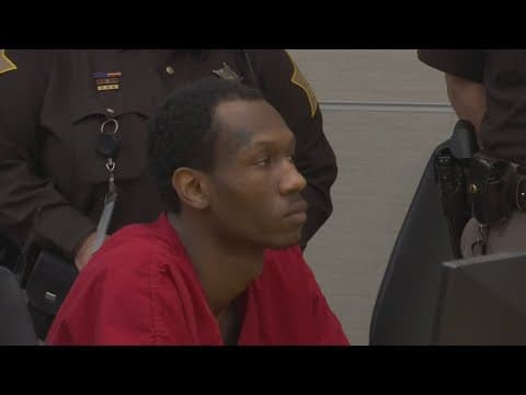 Suspect in Lawrence triple murder in court while alleged accomplice still at large