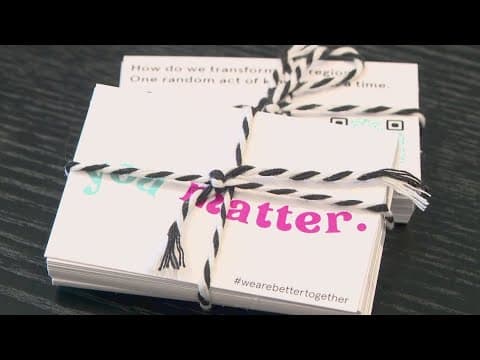 Gulf Coast Community Foundation spreading kindness through business cards that say 'You matter, pass