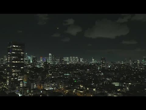 Iran says it fired dozens of missiles into Israel, where residents are warned to shelter in place