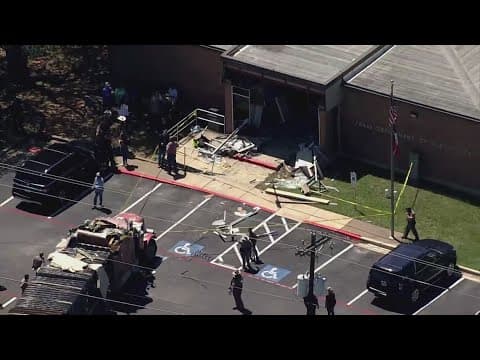 1 dead, 13 injured after stolen semi truck crashes into public safety office