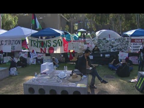 Pro-Israel supporters march past UCSD pro-Palestinian encampment